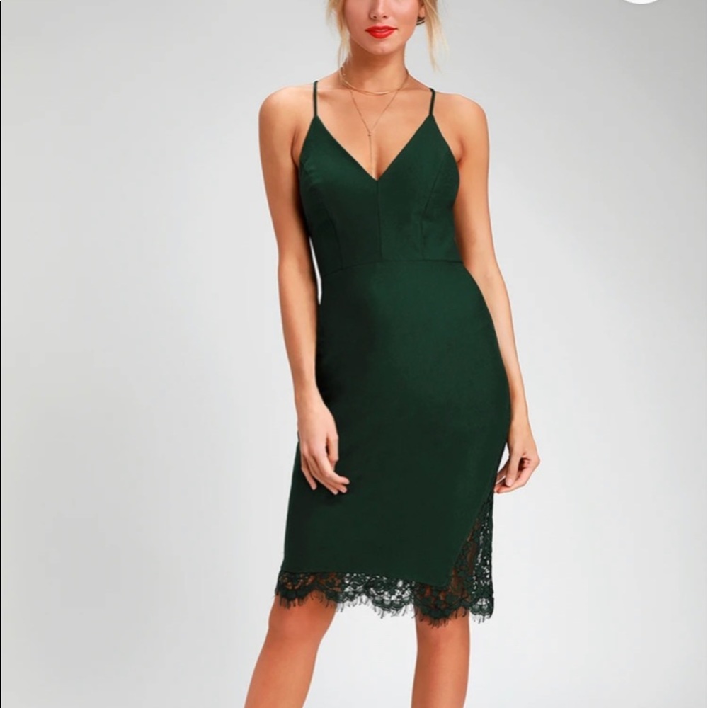 Dark Green fitted dress with lace back and lace hem trim.  Adjustable straps.
